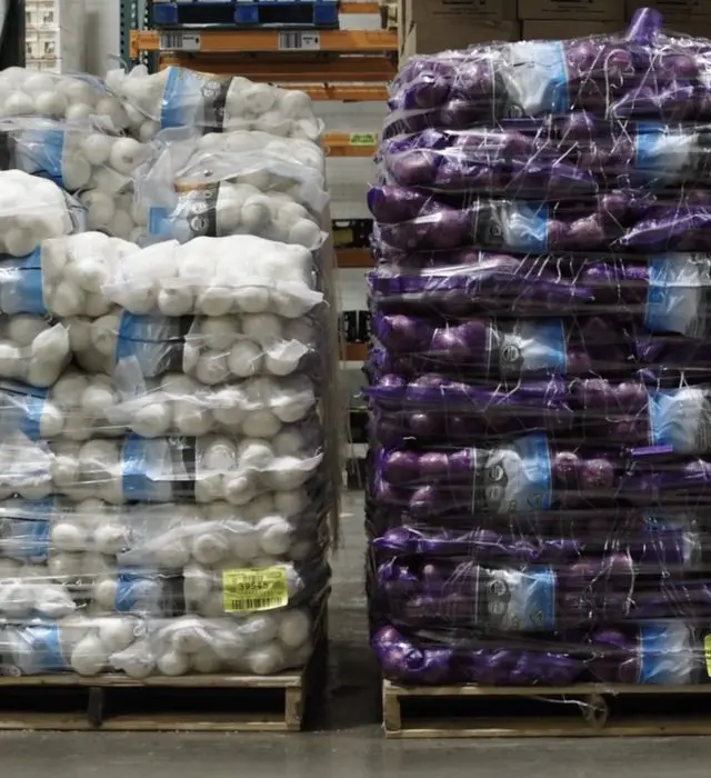 Pallets of packaged products in a warehouse.